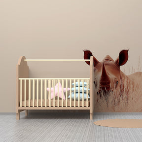 Curious rhinoceros mural wallpaper transforming kids playroom with savannah theme
