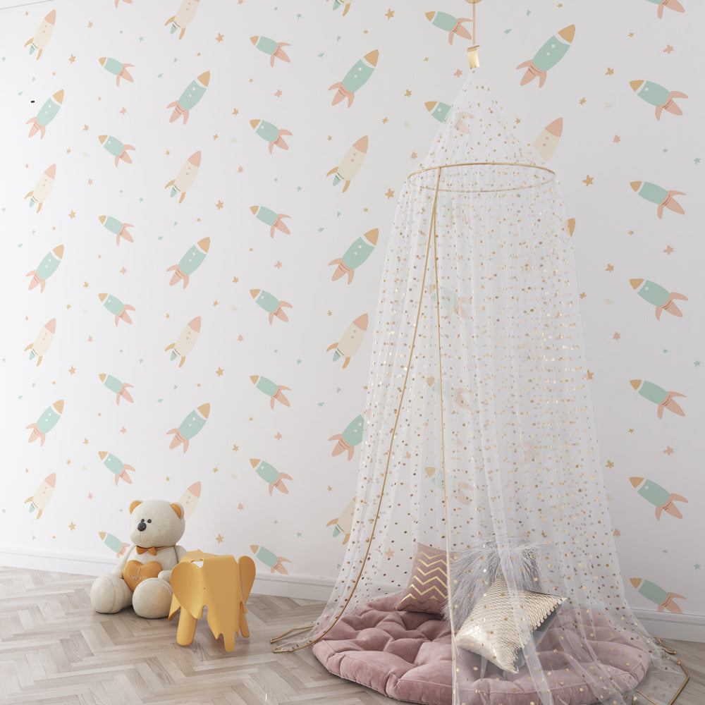 Gentle pastel space mural wallpaper for toddler room with wooden furniture by Kids-Mundo