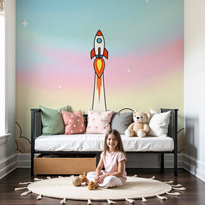Rocket space mural wallpaper with pastel clouds in modern nursery by Kids-Mundo