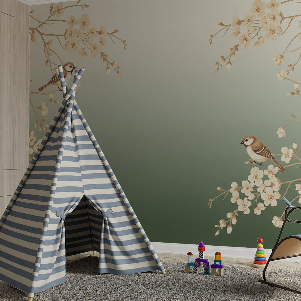 Kids-Mundo blossom tree branch mural behind a cot bed in a gentle green kids bedroom.