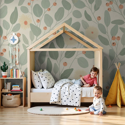 Kids-Mundo sage botanical leaf and berry wall mural styled behind a cot in a calm cream nursery