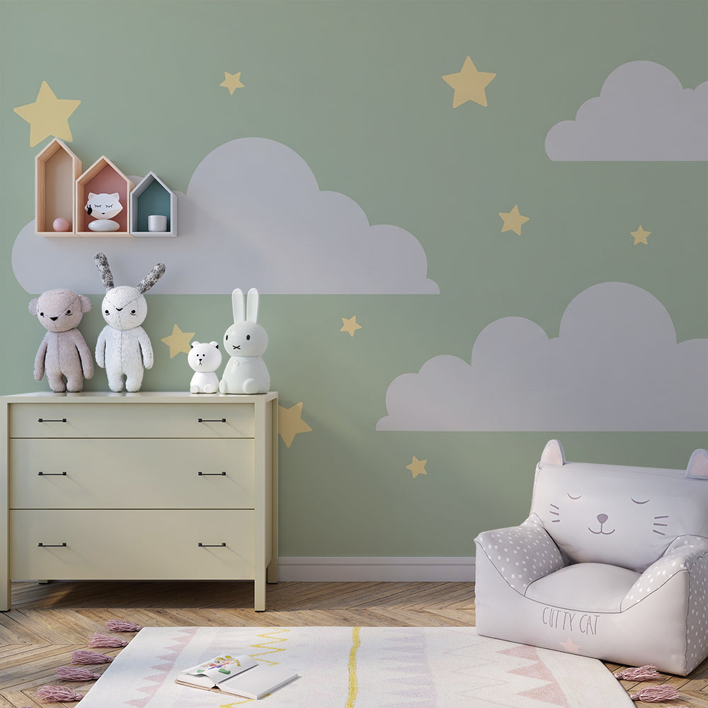 Kids-Mundo sage green clouds wall mural behind a bed in a soft, modern kids bedroom