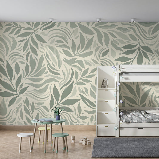 Kids-Mundo sage green leaf wall mural behind a bed in a soft, natural kids bedroom setting