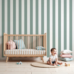Sage green striped mural wallpaper in elegant nursery with white crib by Kids-Mundo