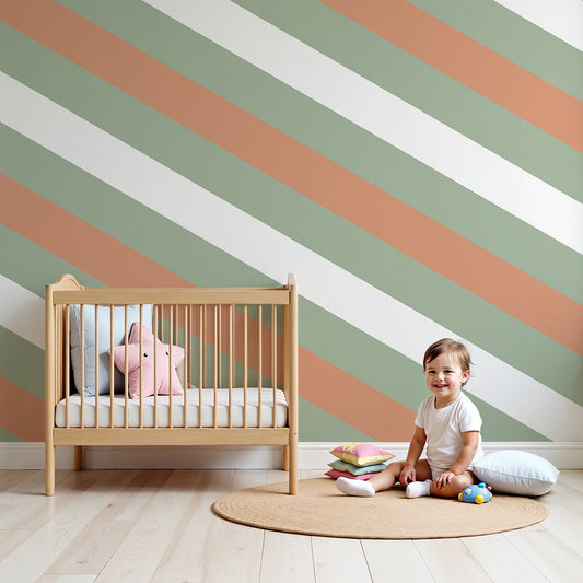 Kids-Mundo sage green and terracotta stripe wall mural styled behind a cot in a natural nursery