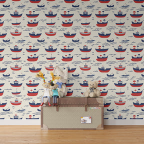 Maritime sailboat wallpaper creating adventurous kids bedroom with red and blue boats