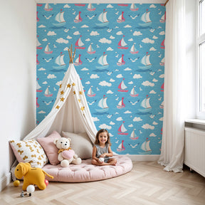 Sailboat mural wallpaper creating oceanic nursery atmosphere with colorful boats and blue skies by Kids-Mundo