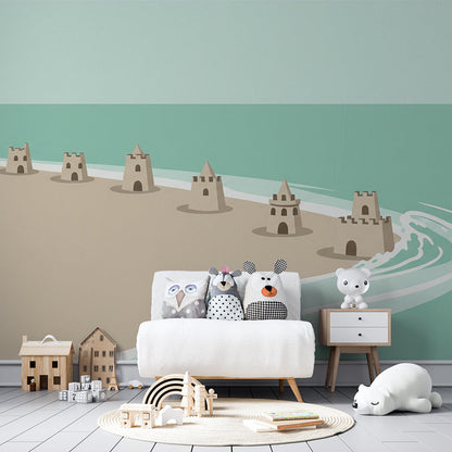 Kids-Mundo turquoise beach wall mural on a child's bedroom wall, showing sandcastles along a curving shoreline.