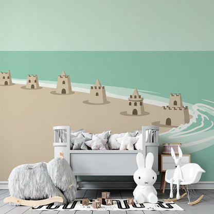 Kids-Mundo sandcastle beach wall mural in a playroom, made-to-measure wallpaper with warm sand and turquoise sea.