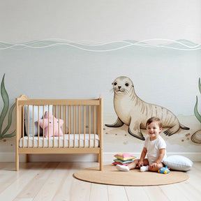 Sea seal mural wallpaper in modern baby nursery with light wood crib by Kids-Mundo