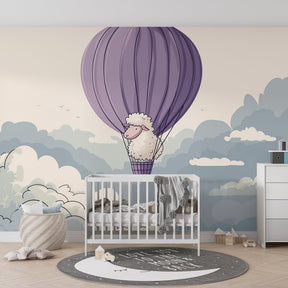 Whimsical sheep balloon mural wallpaper with soft blue clouds for baby room decor by Kids-Mundo