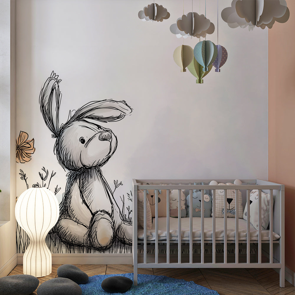 Kids-Mundo bunny wall mural behind a bed in a gentle, storybook-style kids bedroom