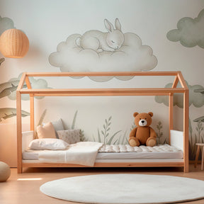 Cloud bunny wallpaper creating serene atmosphere in modern baby bedroom with natural decor