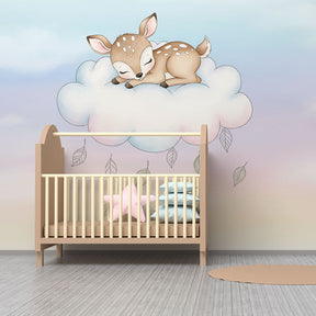 Baby room mural wallpaper featuring sleeping fawn on cloud with soft pink and blue tones