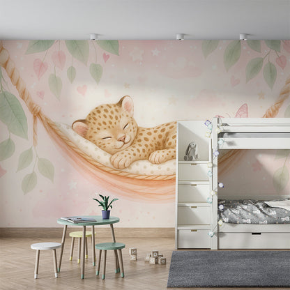Kids-Mundo leopard cub hammock wall mural shown on a kids bedroom wall behind a bed.