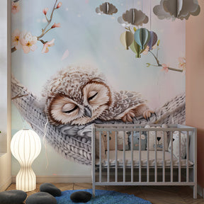 Pastel owl mural wallpaper creating serene children's bedroom decor with cherry blossoms