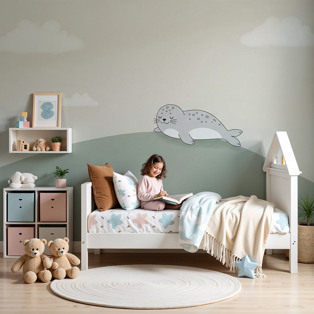 Sleeping seal mural wallpaper in peaceful baby nursery with natural wood crib by Kids-Mundo