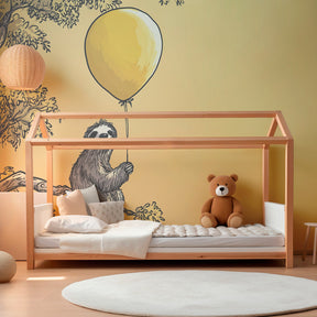 Yellow balloon sloth mural wallpaper transforming baby room into serene sanctuary