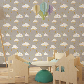 Cheerful cloud faces and star pattern mural wallpaper for peaceful kids room by Kids-Mundo