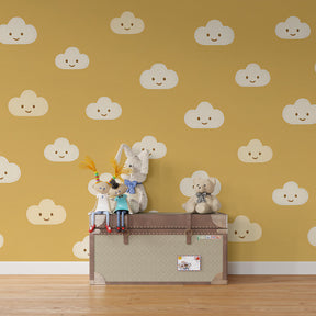 Happy clouds wallpaper transforming kids playroom with warm golden tones and playful design