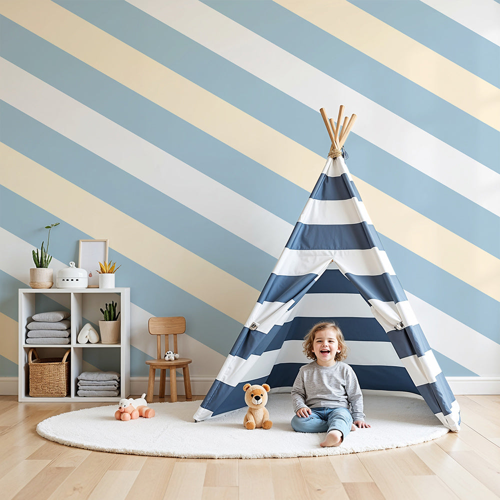 Kids-Mundo blue and cream striped wall mural in a light, airy nursery with white cot