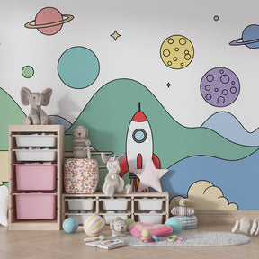 Rocket ship mural wallpaper creating cosmic themed kids bedroom with colorful mountains