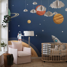 Cosmic themed mural wallpaper creating magical space nursery with astronaut and colorful planets