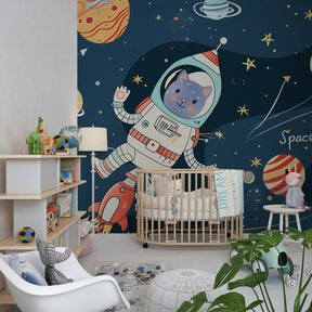 Blue rocket galaxy wallpaper creating cosmic nursery decor with cat astronaut theme