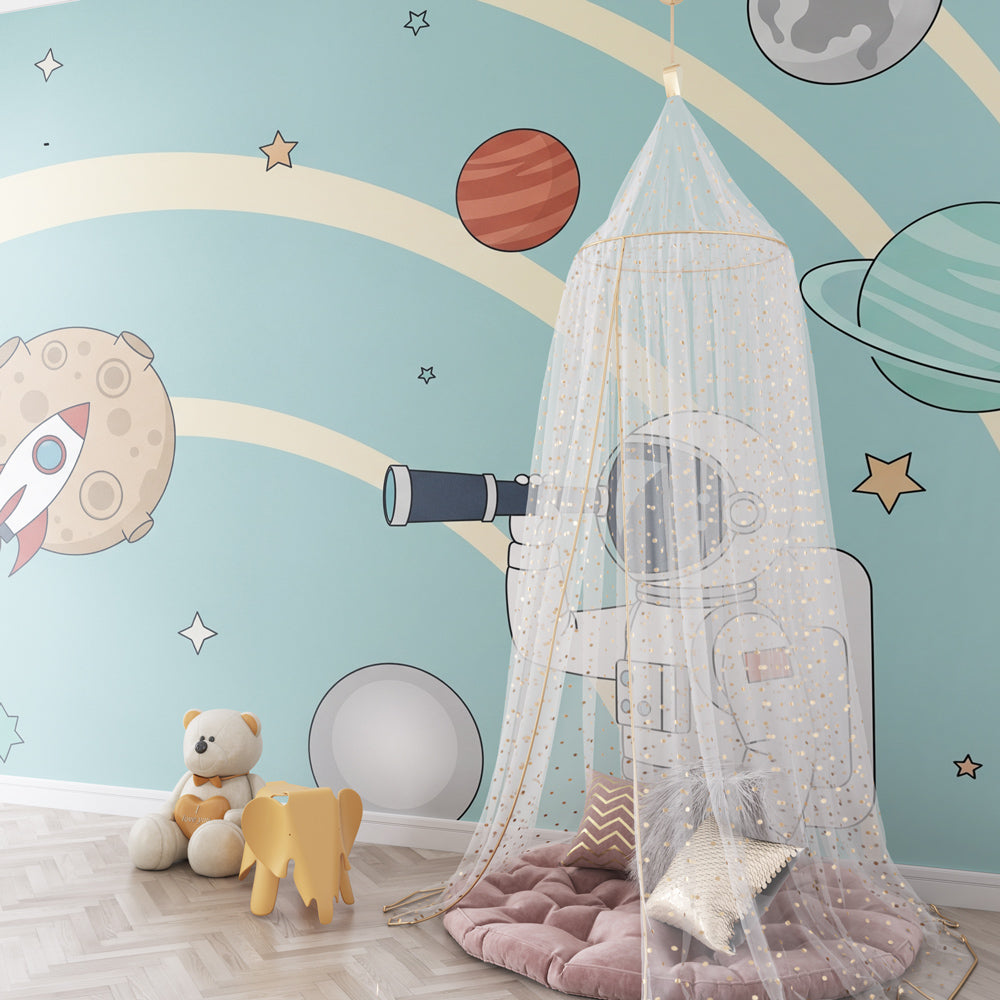 Astronaut adventure mural wallpaper creating cosmic nursery atmosphere with planets and stars