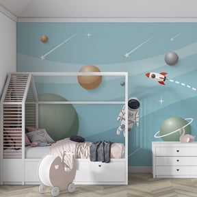 Astronaut and rocket mural wallpaper creating cosmic adventure in kids bedroom decor
