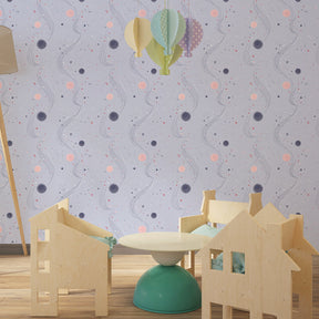 Colorful planets and stars mural wallpaper creating cosmic atmosphere in children's bedroom