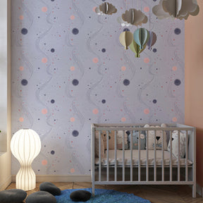 Universe themed mural wallpaper with blue and pink tones in kids playroom setting