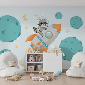 Kids bedroom featuring space raccoon astronaut wallpaper with planets and rockets decor