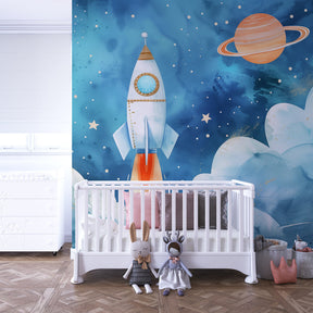 Space adventure wallpaper creating dreamy kids bedroom with soft blue rockets and stars
