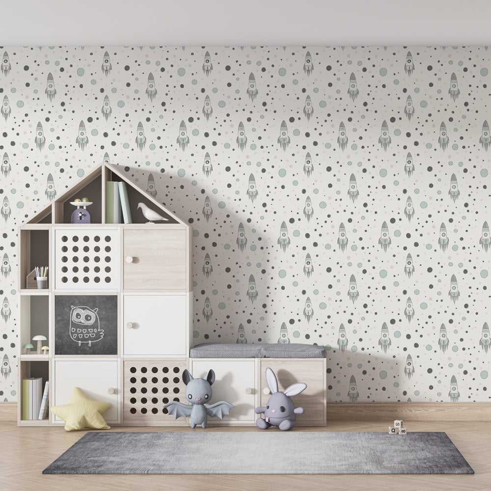Gentle rocket and stars wallpaper creating peaceful children's bedroom atmosphere