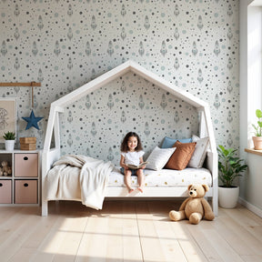 Space rocket mural wallpaper in serene nursery with natural wood crib by Kids-Mundo