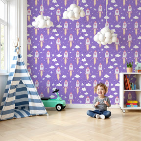 Space rocket mural wallpaper in purple nursery with friendly ships and clouds by Kids-Mundo