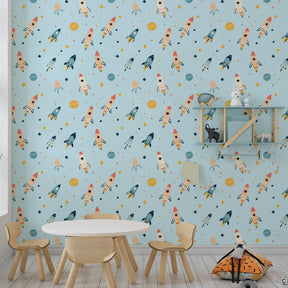 Colorful rocket wallpaper creating cosmic nursery decor with twinkling stars and planets