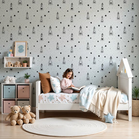 Space rocket mural wallpaper with black white planets in modern nursery room by Kids-Mundo