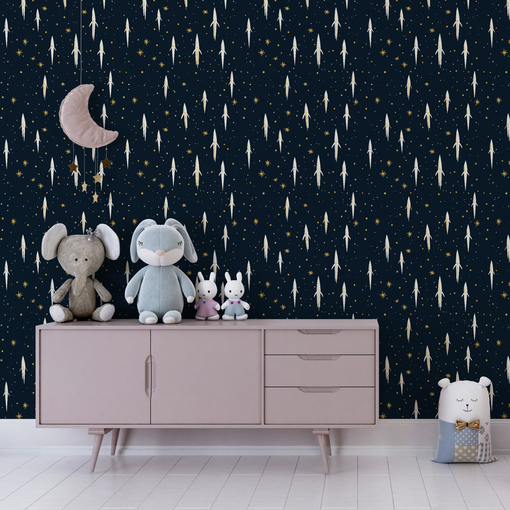 White rocket wallpaper on midnight blue background transforming kids playroom into space adventure zone