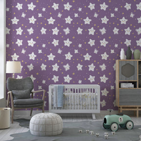 Celestial star wallpaper with golden accents decorating modern kids playroom space
