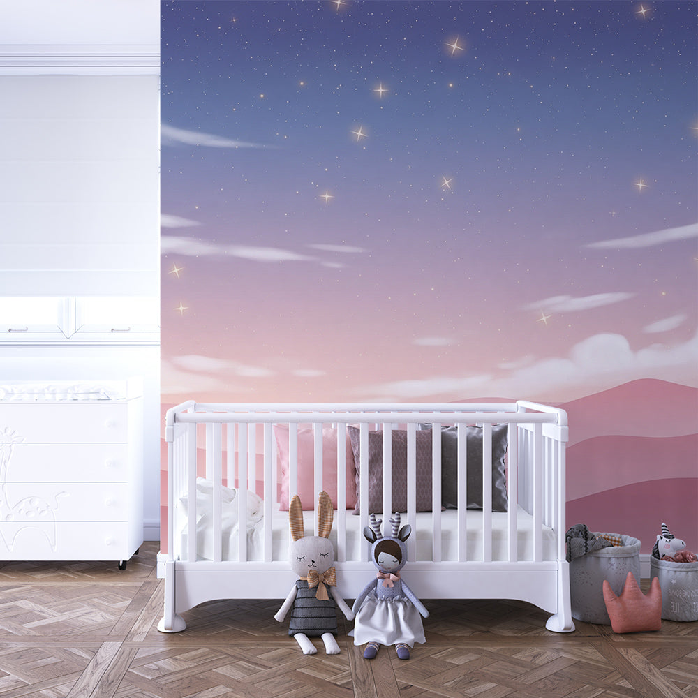 Kids-Mundo starry sky wall mural covering a feature wall in a soft pink kids bedroom