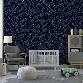 White stars and waves pattern on navy background transforming child's room into celestial space