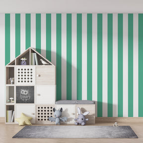 Modern striped mural wallpaper accent wall in kids playroom with colorful toys by Kids-Mundo