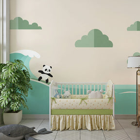 Beach themed panda mural wallpaper with turquoise waves in bright kids playroom