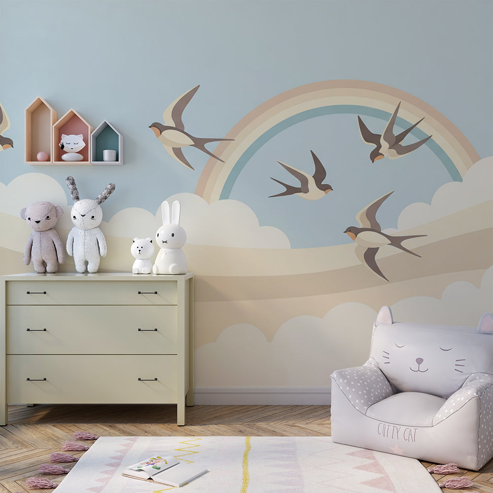 Kids-Mundo swallow and rainbow wall mural in a child's bedroom, adding a calm, airy feel above the bed.