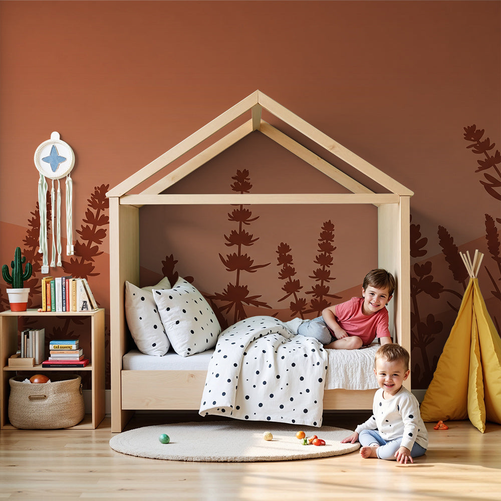 Kids-Mundo terracotta wildflower wall mural styled behind a cot in a warm, neutral nursery