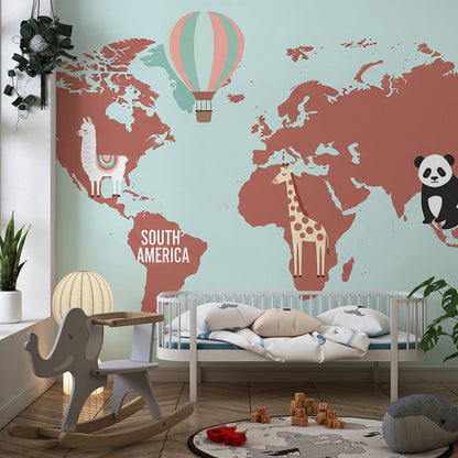 Kids-Mundo terracotta world map mural with koala and llama in a playroom setting