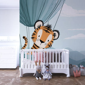 Children's tiger balloon wallpaper transforming playroom with dreamy cloud and mountain scene