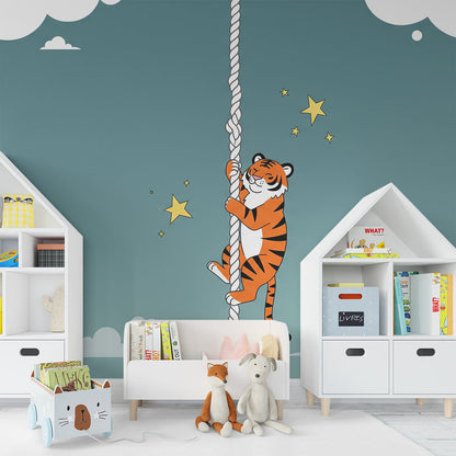 Kids-Mundo tiger climbing rope wall mural above a cot in a starry nursery